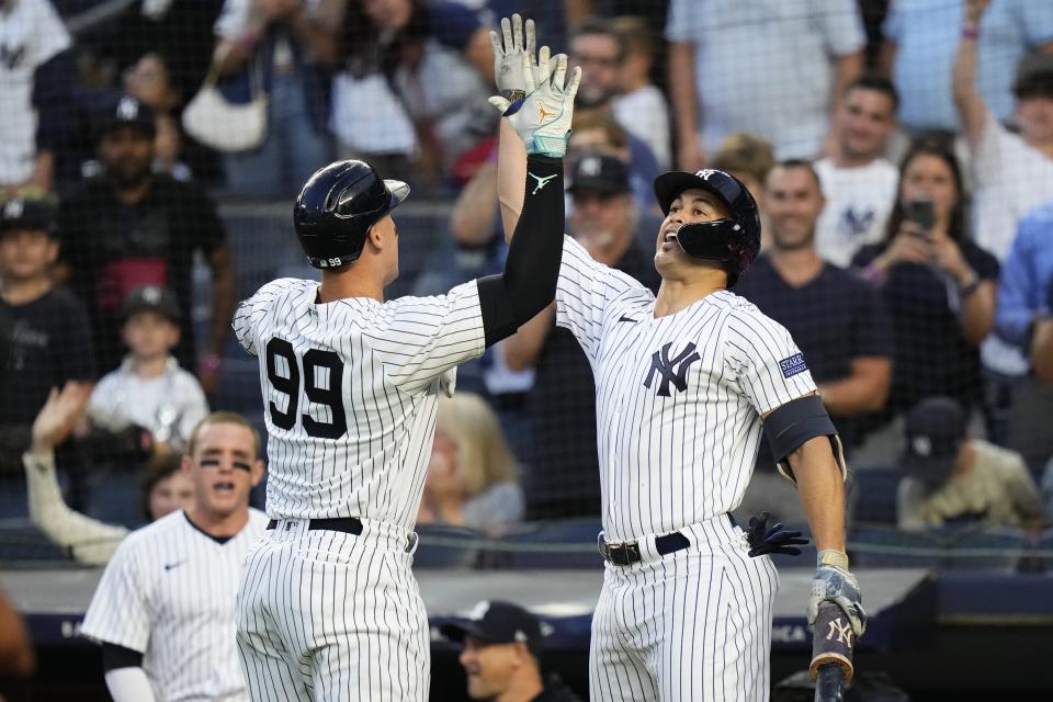 New York Yankees' Aaron Judge, left, celebrates with Giancarlo Stanton after hitting a home run against the Washington Nationals during the first inning of a baseball game Wednesday, Aug. 23, 2023, in New York. (AP Photo/Frank Franklin II)