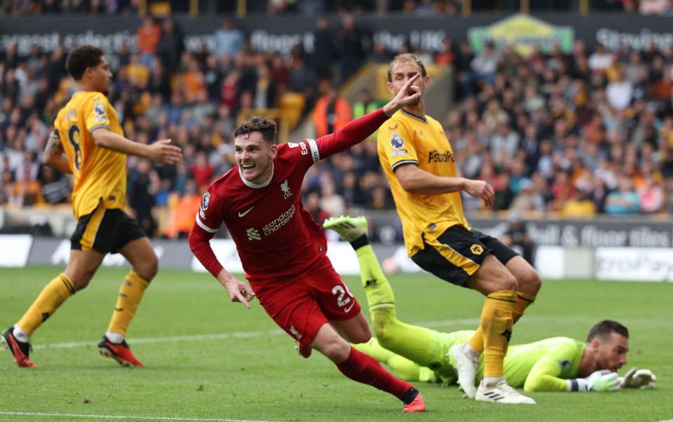Liverpool's Scottish defender #26 Andrew Robertson (C) celebrates after scoring their second goal during the English Premier League football match between Wolverhampton Wanderers and Liverpool at the Molineux stadium in Wolverhampton, central England on September 16, 2023.