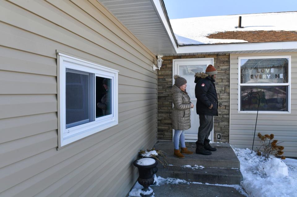 Phil and Andrea Robinson talk about recent repairs to their home Wednesday, Jan. 19, 2022, in Cold Spring.