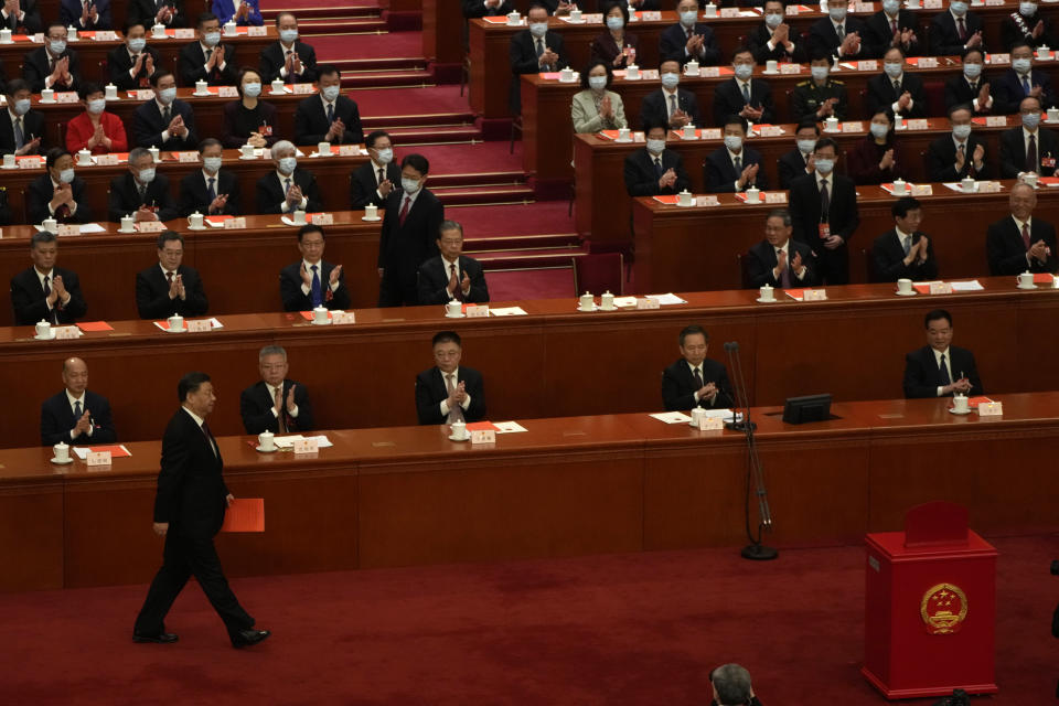 Chinese President Xi Jinping walks to cast his vote during a session of China's National People's Congress (NPC) to select state leaders at the Great Hall of the People in Beijing, Friday, March 10, 2023. (AP Photo/Mark Schiefelbein)