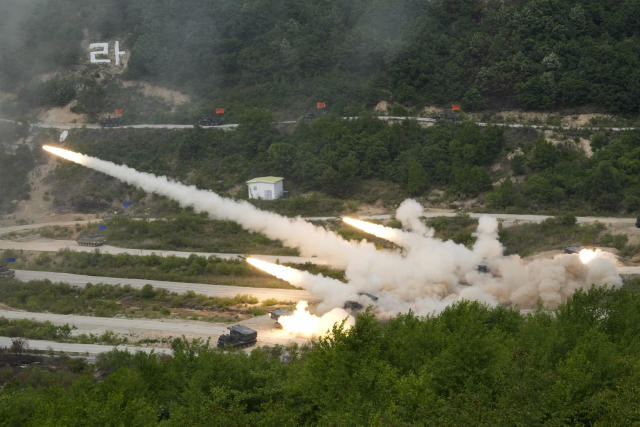 South Korean army's multiple launch rocket systems fire rockets during South Korea-U.S. joint military drills at Seungjin Fire Training Field in Pocheon, South Korea, Thursday, May 25, 2023. The South Korean and U.S. militaries held massive live-fire drills near the border with North Korea on Thursday, despite the North's warning that it won't tolerate what it calls such a hostile invasion rehearsal on its doorstep. (AP Photo/Ahn Young-joon)