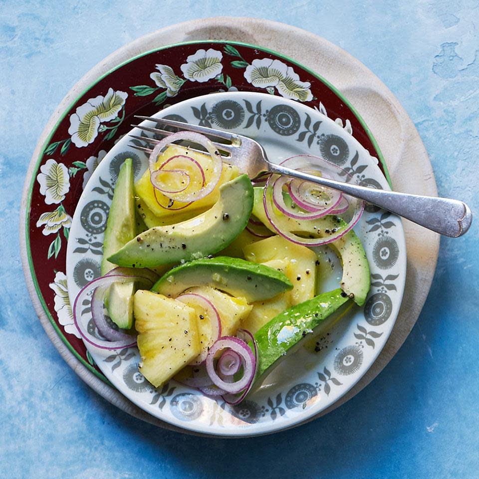<p>This refreshing, simple Cuban salad recipe captures the flavors of the tropics. Serve alongside spiced chicken or pork, with rice and beans. <a href="https://www.eatingwell.com/recipe/252829/pineapple-avocado-salad/" rel="nofollow noopener" target="_blank" data-ylk="slk:View Recipe" class="link ">View Recipe</a></p>