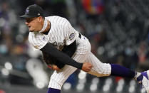 Colorado Rockies relief pitcher Robert Stephenson watches a throw to a Houston Astros batter during the ninth inning of a baseball game Tuesday, April 20, 2021, in Denver. (AP Photo/David Zalubowski)