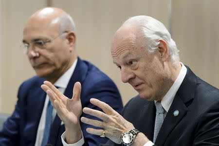 U.N. mediator on Syria Staffan de Mistura (R) gestures next to his Deputy Ramzy Ezzeldin Ramzy during a meeting with the Syrian government delegation during Syria peace talks at the United Nations in Geneva, Switzerland, April 15, 2016. REUTERS/Fabrice Coffrini/Pool