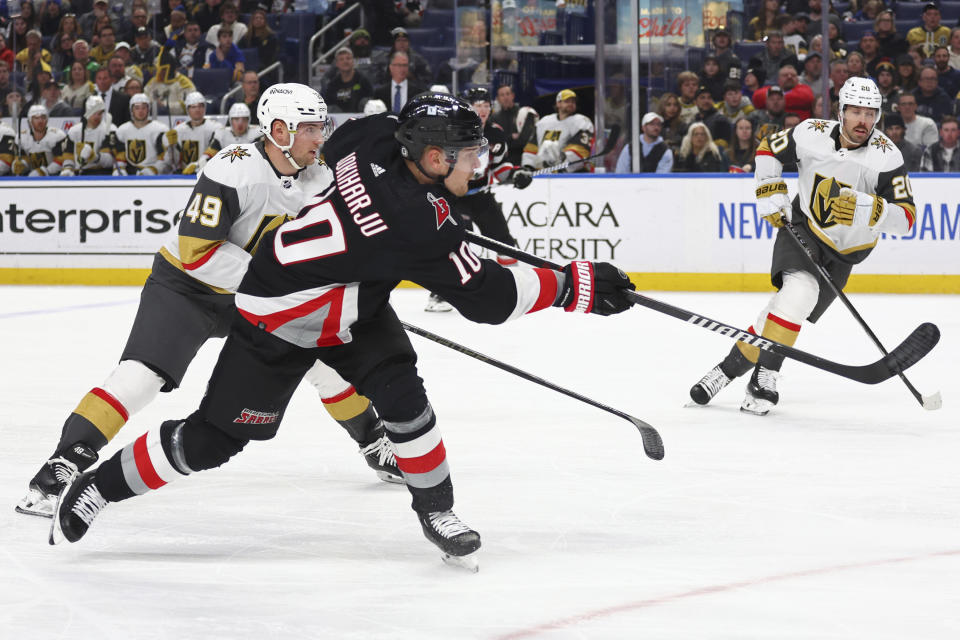 Buffalo Sabres defenseman Henri Jokiharju (10) shoots on goal during the first period of an NHL hockey game against the Vegas Golden Knights, Saturday, March. 2, 2024, in Buffalo, N.Y. (AP Photo/Jeffrey T. Barnes)