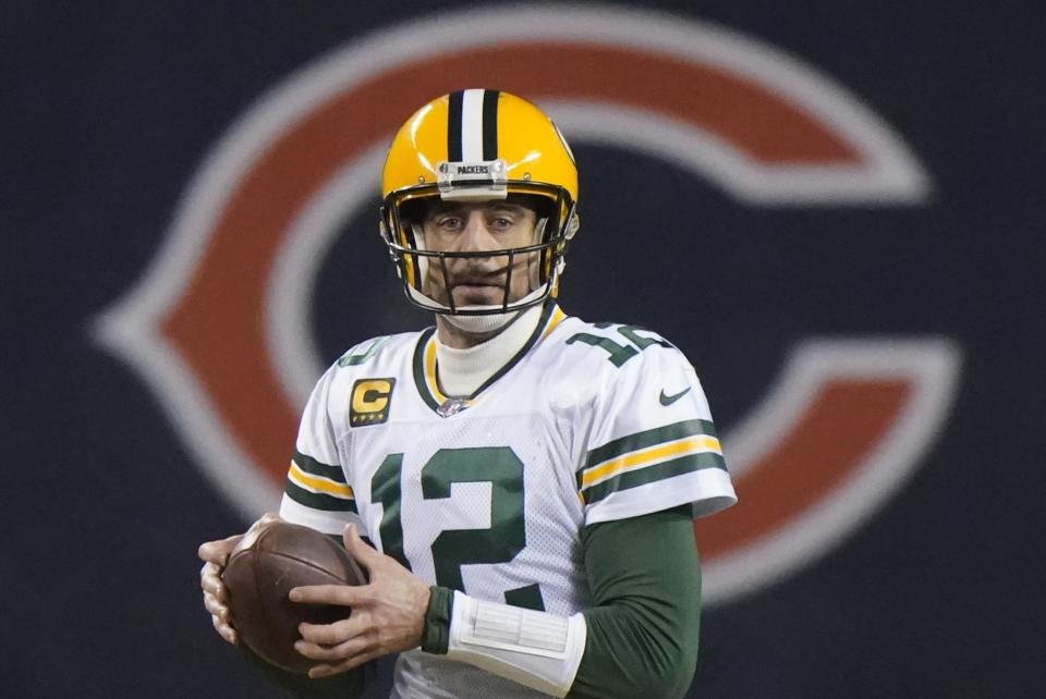 Green Bay Packers' Aaron Rodgers looks to pass during the second half of an NFL football game against the Chicago Bears Sunday, Jan. 3, 2021, in Chicago. (AP Photo/Nam Y. Huh)