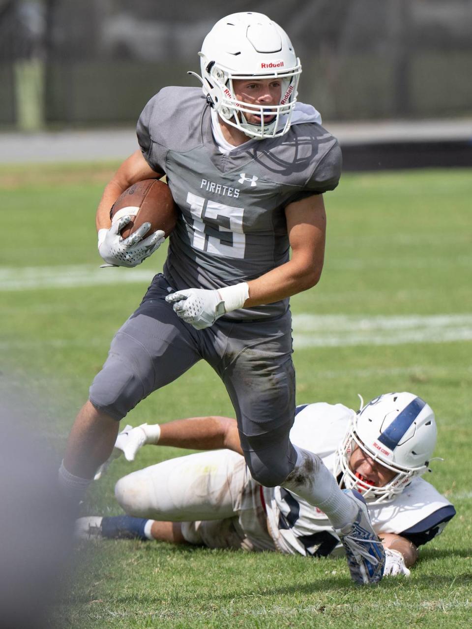 Modesto’s Joey Stout breaks a tackle during the game with Santa Rosa at Modesto Junior College in Modesto, Calif., Saturday, September 9, 2023. Modesto won the game the game 51-41.