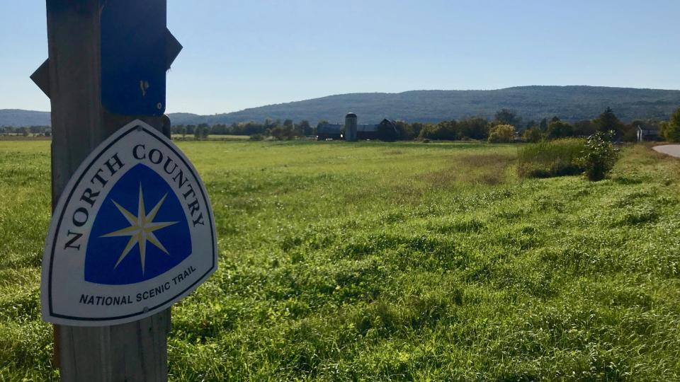 A North Country National Scenic Trail sign in the Champlain Valley.