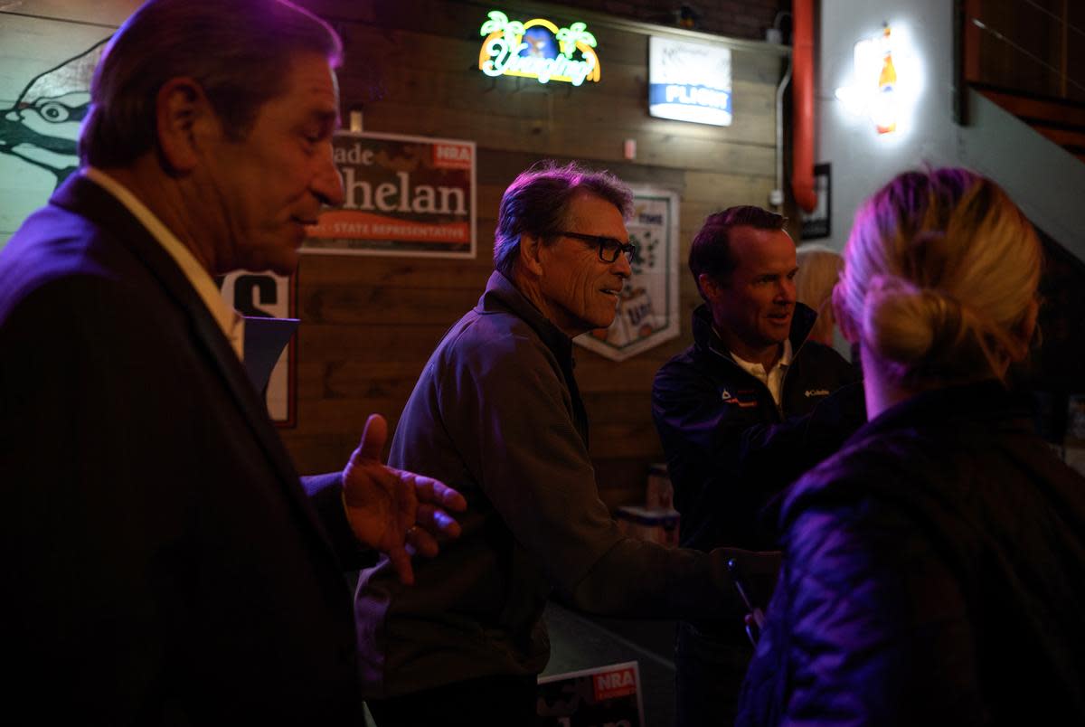 Former Gov. Rick Perry and Texas House Speaker Dade Phelan mingle with supporters during a Get Out the Vote Rally on Thursday, February 29, 2024, in Vidor, Texas. Deep fissures within the Republican Party have placed Phelan as the No. 1 enemy of Texas’ far-right conservatives.