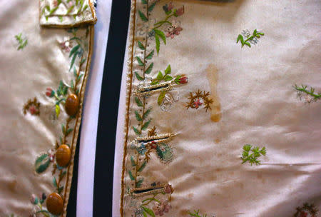 A stain said to be from wine can be seen on a 250-year-old embroidered silk waistcoat that belonged to Captain James Cook, during a display at Aalders Auctions house in Sydney, Australia, March 22, 2017. Picture taken March 22, 2017. REUTERS/David Gray