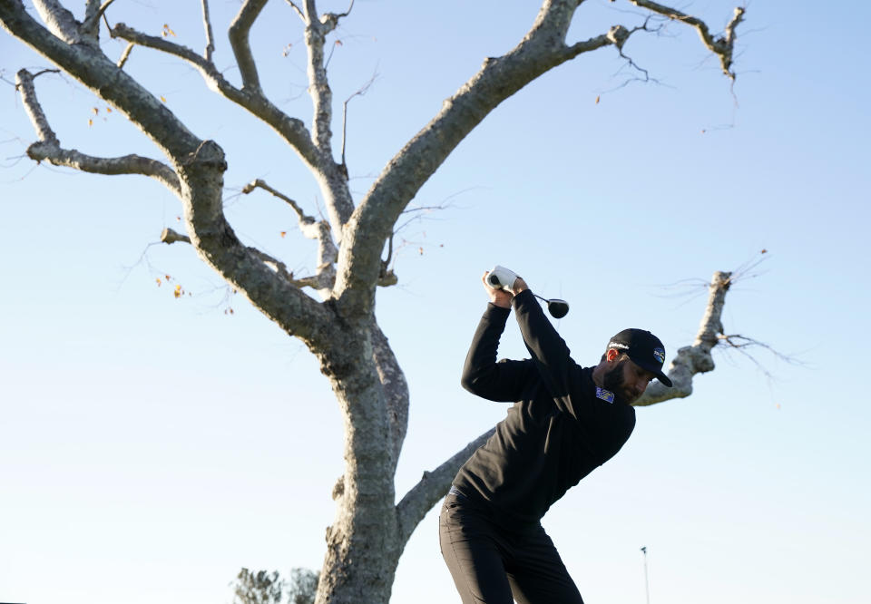 Dustin Johnson tees off on the third hole during the Genesis Invitational pro-am golf event at Riviera Country Club, Wednesday, Feb. 17, 2021, in the Pacific Palisades area of Los Angeles. (AP Photo/Ryan Kang)