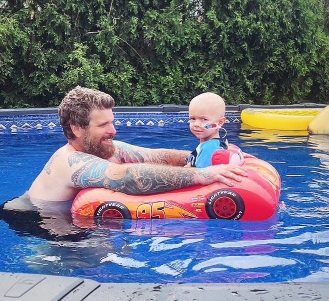 Mick Augustitus with dad Mike Augustitus in their new pool at their Hazlet home.