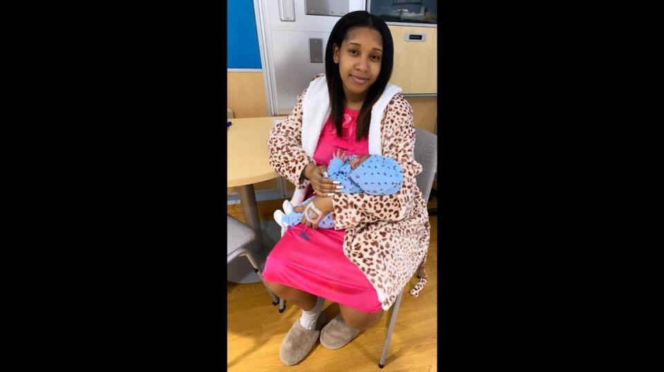 Shirdykyia Myrick, 20, holds her firstborn, a baby girl named D-Zani Burden. D-Zani is the first baby born in the new year at Jackson Memorial Hospital. She arrived at 1:10 a.m. weighing 7 pounds and 7 ounces on Friday, Jan. 1, 2021.