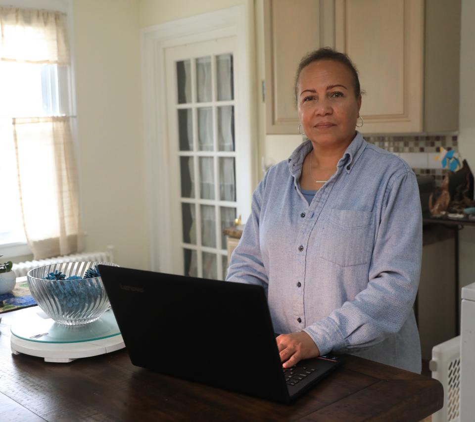 Sharon Churton searches for jobs on her computer while at her home in Wappingers Falls on March 31, 2022. 