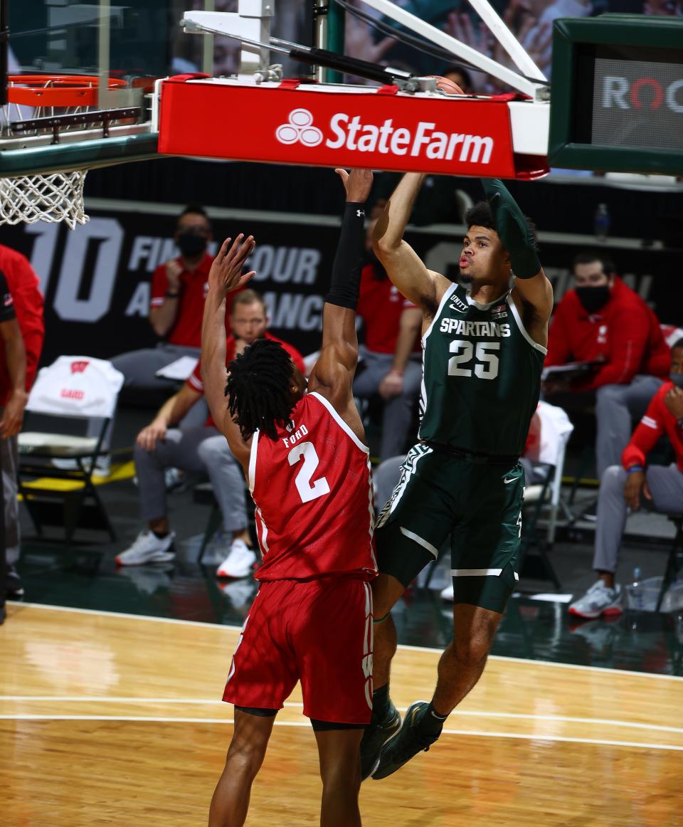 Michigan State's Malik Hall shoots over Wisconsin's Aleem Ford at Breslin Center on Dec. 25, 2020 in East Lansing.