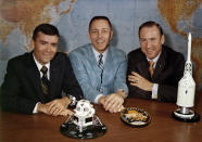 In this April 10, 1970 photo made available by NASA, Apollo 13 astronauts, from left, Fred Haise, Jack Swigert and Jim Lovell gather for a photo on the day before launch. (NASA via AP)