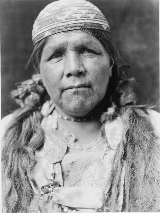 Hupa woman, head-and-shoulders portrait, facing front.
