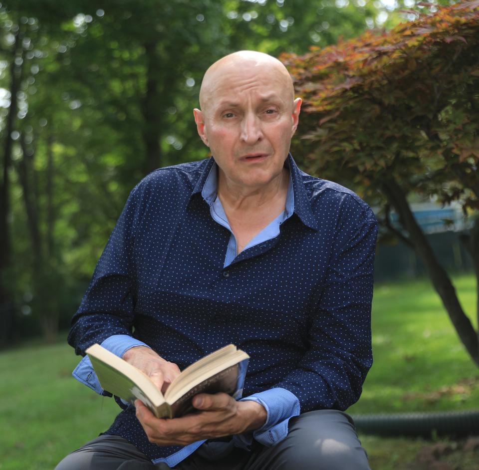 Dario Saraceno reads a copy of Sam Shepard's plays while at home in Wappingers Falls on August 21, 2023. Sarceno, a SAG actor is currently not doing regular acting work due to the labor dispute between the SAG union and film & television studios. 
