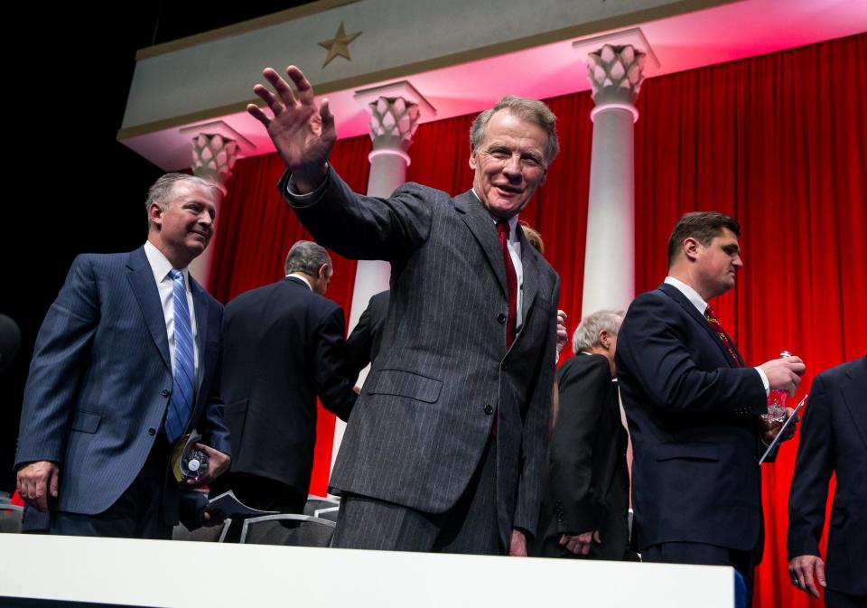 Illinois Speaker of the House Michael Madigan waves into the crowd as he makes his way off stage at the conclusion of the Illinois Inaugural Ceremony at the Prairie Capital Convention Center, Monday, Jan. 12, 2015, in Springfield, Ill. [Justin L. Fowler/The State Journal-Register] 