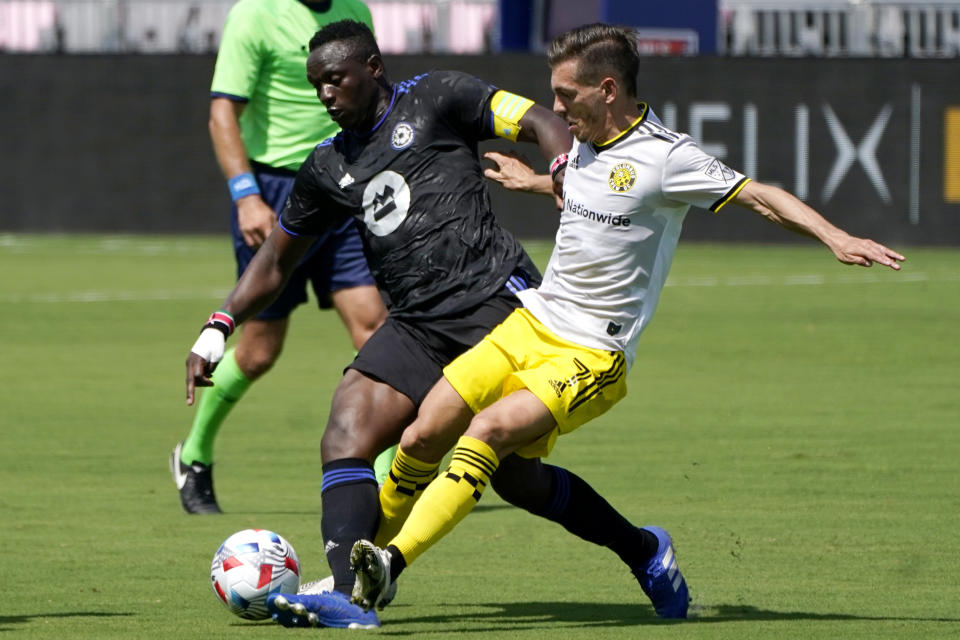 CF Montréal midfielder Victor Wanyama, left, and Columbus Crew forward Pedro Santos, right, go for the ball during the first half of an MLS soccer match, Saturday, May 1, 2021, in Fort Lauderdale, Fla. (AP Photo/Lynne Sladky)