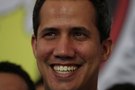 Venezuelan opposition leader Juan Guaido, who many nations have recognized as the country's rightful interim ruler, attends a political rally in Caracas