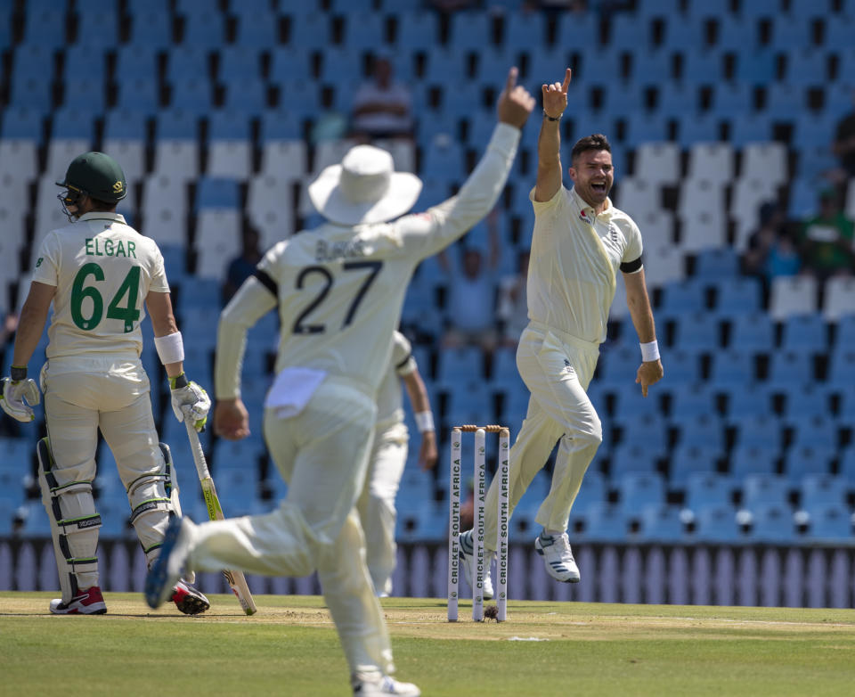 England's bowler James Anderson, right, celebrates with teammates after dismissing South Africa's Dean Elgar, far left, for a duck on day one of the first cricket test match between South Africa and England at Centurion Park, Pretoria, South Africa, Thursday, Dec. 26, 2019. (AP Photo/Themba Hadebe)