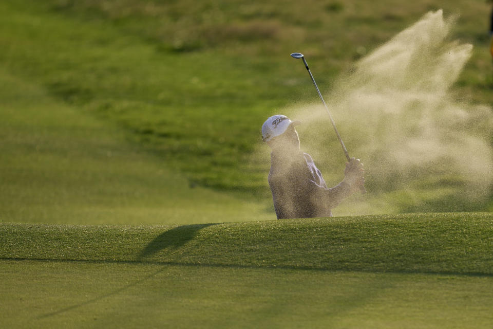 United States' Justin Thomas hits out of a bunker on the 18th green on the first day of the British Open Golf Championships at the Royal Liverpool Golf Club in Hoylake, England, Thursday, July 20, 2023. (AP Photo/Kin Cheung)