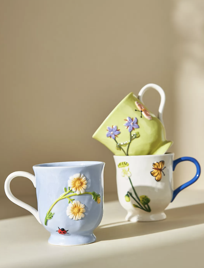 Faye Mug in blue, white and green mugs with floral design (Photo via Anthropologie)