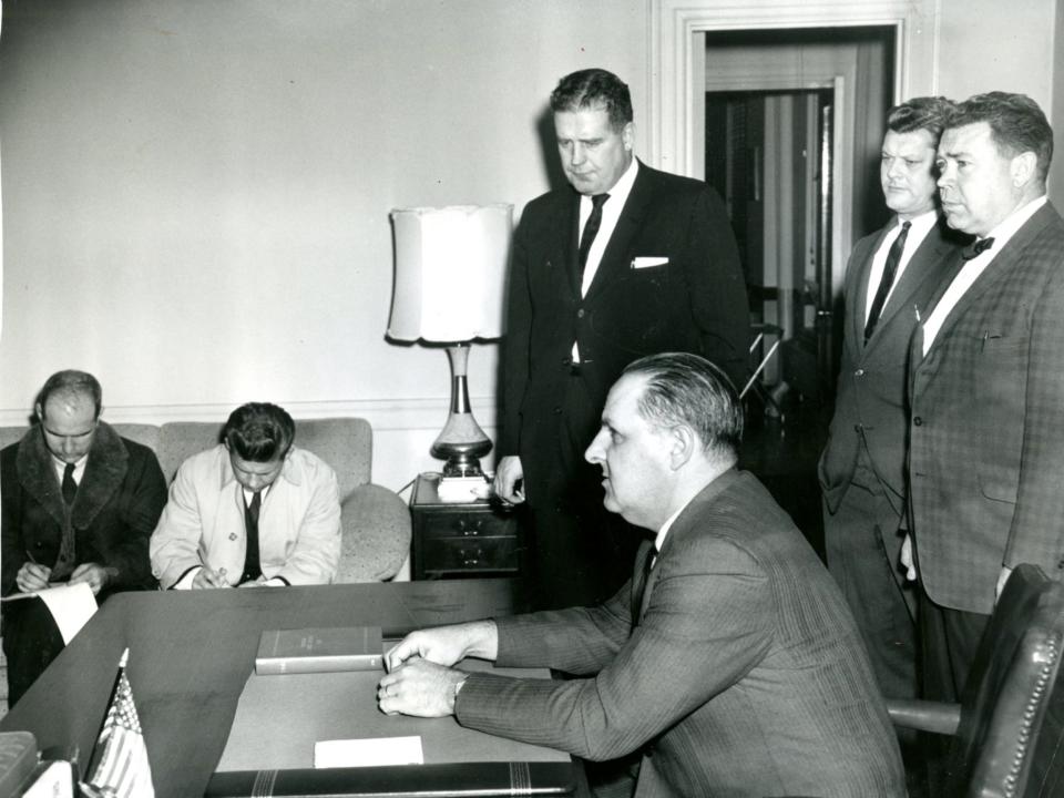 Boston Police Commissioner Edmund McNamara holds a press conference in 1969.