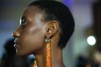 A model poses backstage wearing jewellery designed for Niger's designer Alia Bare's show during Johannesburg Fashion Week 2023 in Johannesburg, South Africa, Thursday, Nov. 9, 2023. (AP Photo/Jerome Delay)