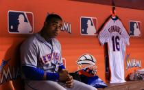 <p>Yoenis Cespedes #52 of the New York Mets looks on from the dugout where he had hung a Jose Fernandez jersey in honor of the late pitcher during the game against the Miami Marlins at Marlins Park on September 26, 2016 in Miami, Florida. (Photo by Rob Foldy/Getty Images) </p>