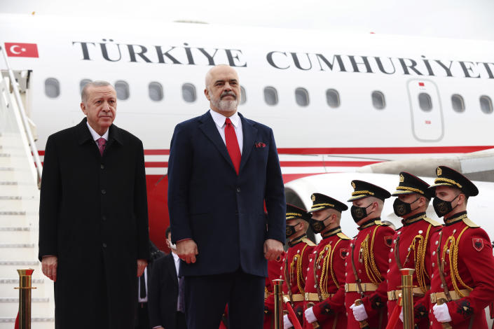 Albanian Prime Minister Edi Rama, right, welcomes the Turkish President Recep Tayyip Erdogan at Tirana International Airport "Mother Teresa", Albania, Monday, Jan. 17, 2022. Turkish President Recep Tayyip Erdogan visits Albania to talk with Prime Minister Edi Rama on strengthening bilateral ties. Erdogan also visits a northwestern town of Lac where Turkey has funded the building of some 500 apartments destroyed by the 2019 earthquake in the tiny Western Balkan country. (AP Photo/Franc Zhurda)