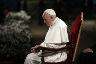 Pope Francis presides over the Via Crucis (Way of the Cross) torchlight procession on Good Friday, a Christian holiday commemorating the crucifixion of Jesus Christ and his death at Calvary, in front of Rome's Colosseum, in Rome, Friday, April 19, 2019. (AP Photo/Andrew Medichini)