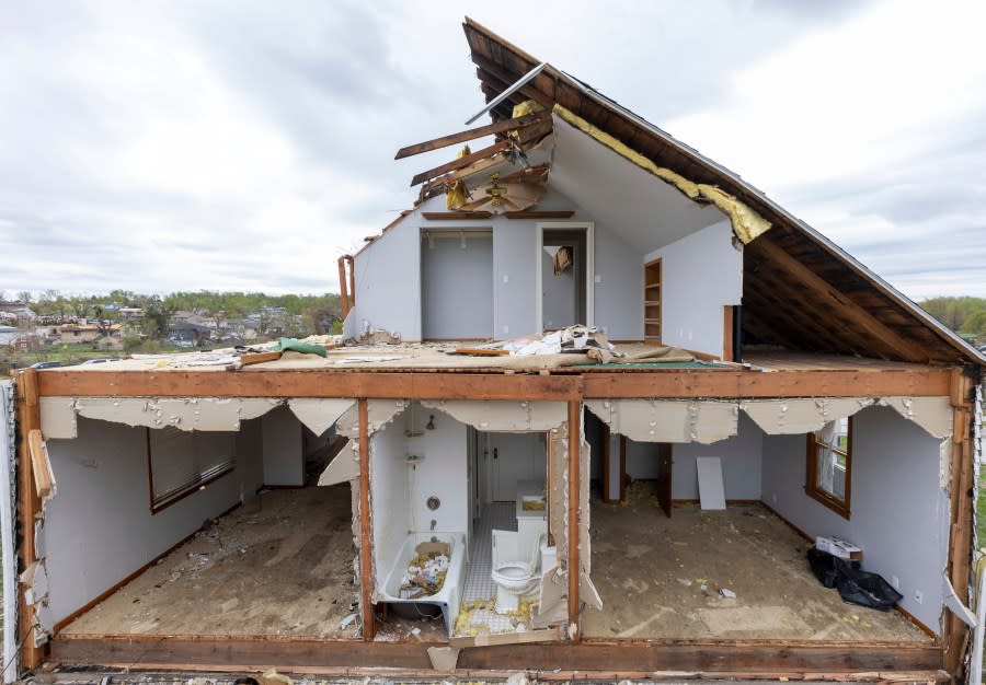 A partially torn off roof is seen on a damaged home in Omaha, Neb., on Saturday, April 27, 2024. Dozens of reported tornadoes wreaked havoc Friday in the Midwest. (Chris Machian/Omaha World-Herald via AP)