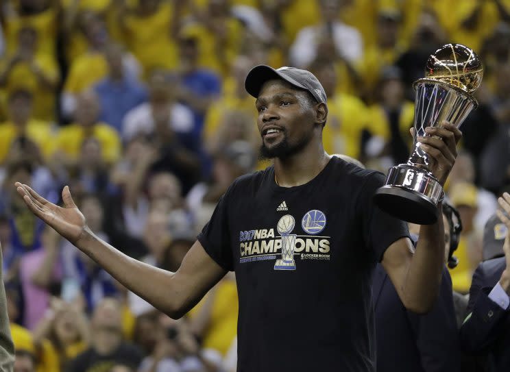 Kevin Durant’s new agreement helps the Warriors keep their core together. (AP)