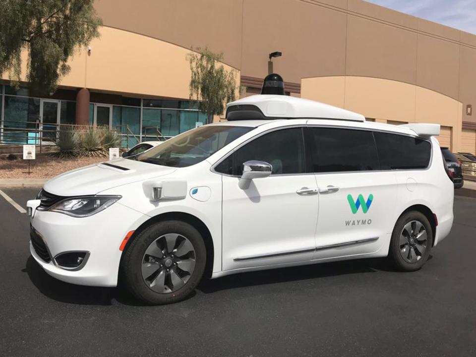 FILE PHOTO: A Waymo self-driving vehicle is parked outside the Alphabet company's offices where its been testing autonomous vehicles in Chandler, Arizona, U.S., March 21, 2018.  REUTERS/Heather Somerville
