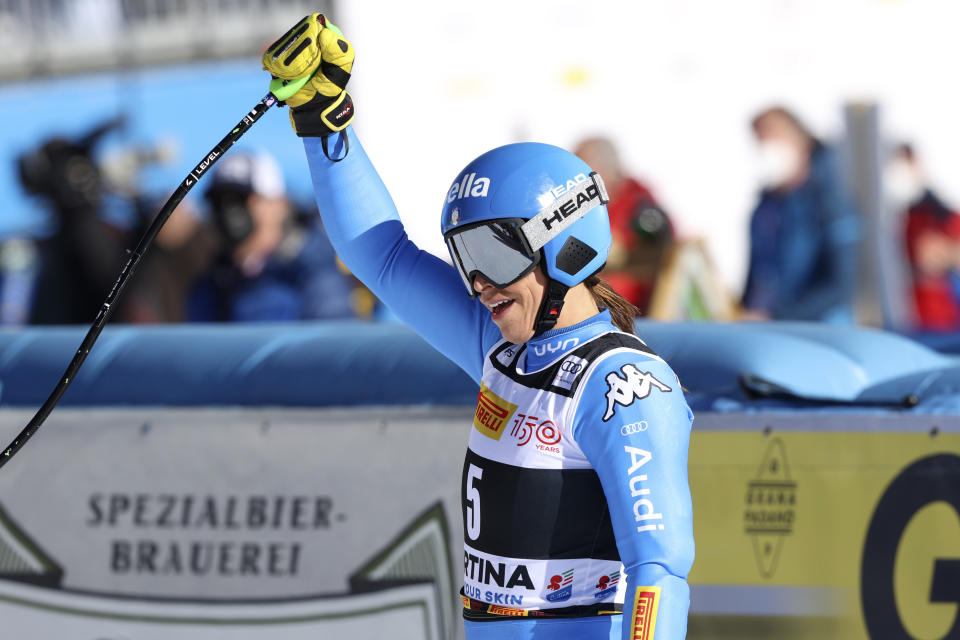 Italy's Elena Curtoni celebrates in the finish area of an alpine ski, women's World Cup super-G race in Cortina d'Ampezzo, Italy, Sunday, Jan. 23, 2022. (AP Photo/Alessandro Trovati)