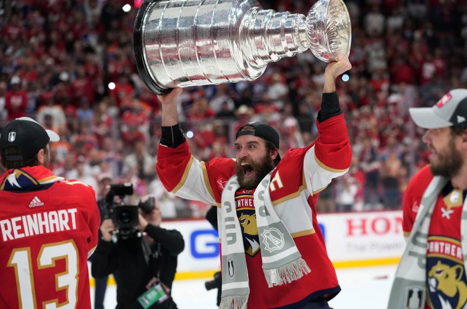 Florida Panthers defenseman Aaron Ekblad raises the NHL Stanley Cup after defeating the Edmonton Oilers in Game 7 of the finals Monday, June 24, 2024, in Sunrise, Fla. (AP Photo/Wilfredo Lee)