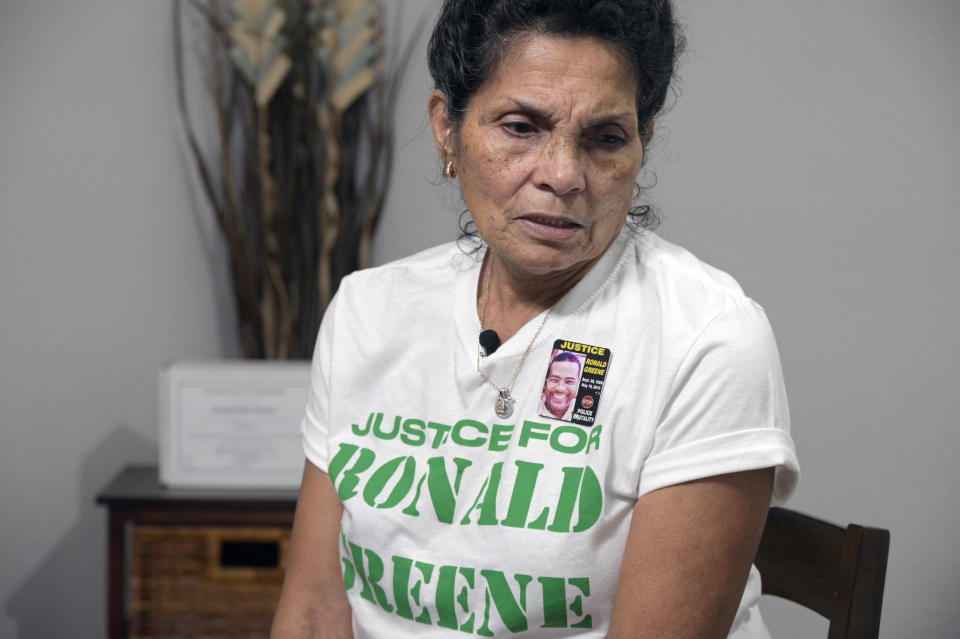 FILE - Mona Hardin relives the events surrounding the death of her son Ronald Greene as his boxed ashes sit behind her on a table, Dec. 4, 2021, in Orlando, Fla. Three years ago, when a beaten and battered Ronald Greene drew his final breath on a rural roadside, his death in Louisiana State Police custody seemed destined for obscurity. Family members were told falsely that he died in a car crash following a high-speed chase. Body camera footage of white troopers stunning, punching and dragging the Black motorist remained secret and withheld from his initial autopsy. Three years later the case has engulfed Louisiana’s elite law enforcement agency in controversy. (AP Photo/Phelan M. Ebenhack)