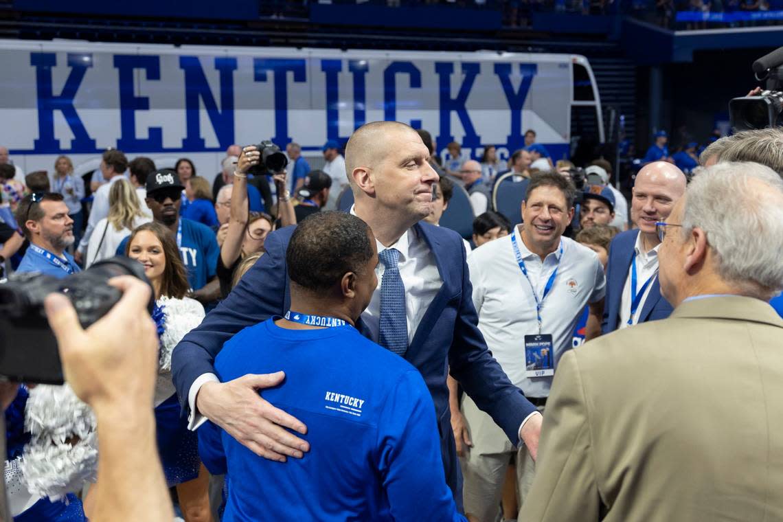 New Kentucky basketball coach Mark Pope speaks with friends and former teammates after making comments and answering questions from reporters during an introductory event at Rupp Arena on April 14.