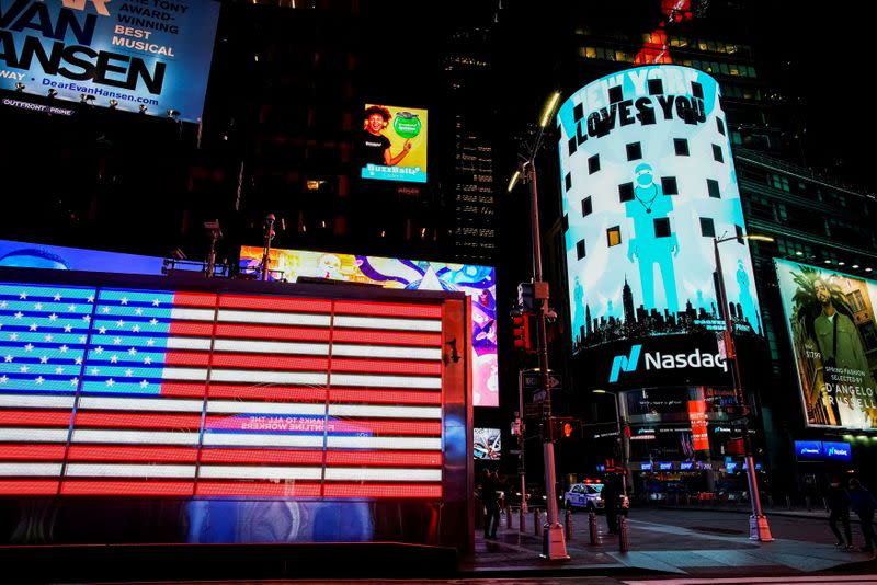 FILE PHOTO: Times Square is illuminated in blue as part of the "Light It Blue" initiative to honor healthcare workers, during the outbreak of the coronavirus disease (COVID-19) in New York