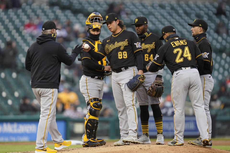 Pittsburgh Pirates manager Derek Shelton takes the ball from pitcher Miguel Yajure in the fifth inning during the second game of a doubleheader baseball game in Detroit, Wednesday, April 21, 2021. (AP Photo/Paul Sancya)