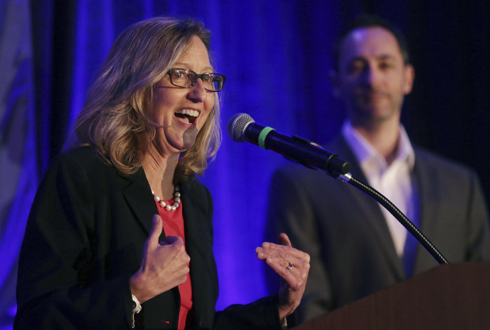 Arizona House of Representatives Legislative District 10 candidate Kirsten Engel speaks during the Pima County Democratic Party Election Night watch party at the DoubleTree by Hilton Hotel in Tucson, Ariz., Nov. 6, 2018. Arizona's only open congressional seat has featured some buzzwords spoken by candidates on both sides: extreme and the American dream. Engel says she's trying to renew the American dream by fighting against a pre-statehood ban on abortion in Arizona. Republican Juan Ciscomani says he's living the American dream as someone who became a naturalized U.S. citizen. (Mike Christy/Arizona Daily Star via AP)