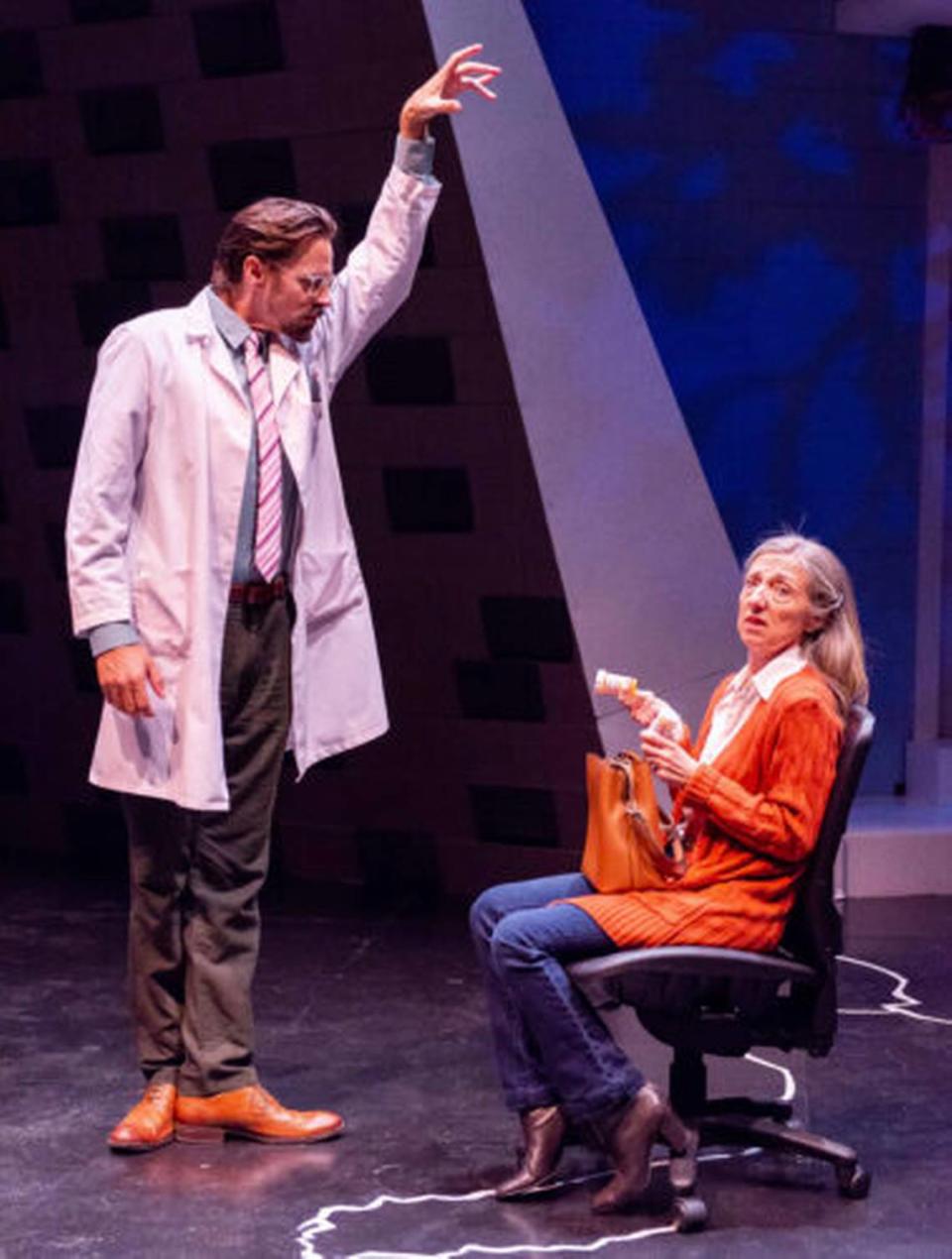 Robert Koutras as Dr. Fine goes overboard trying to cure Jeni Hacker’s Diana with pills in Zoetic Stage’s “Next to Normal” now in the Carnival Studio Theater at the Arsht Center. (Photo courtesy of Justin Namon)