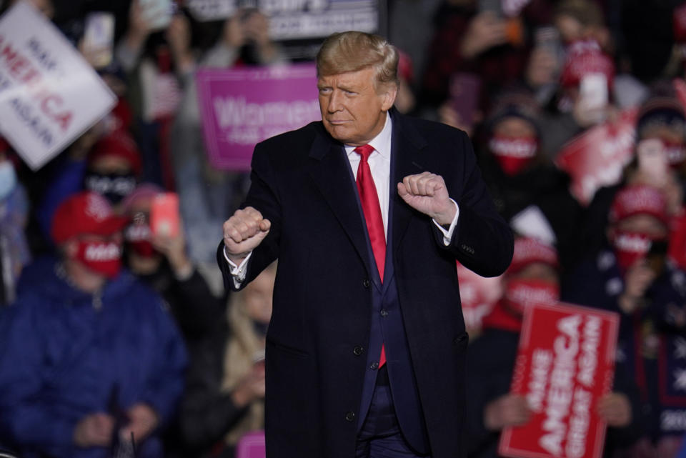 Supporters cheer as President Donald Trump moves to the song "YMCA" at the end of a campaign rally in Erie, Pennsylvania, on Oct. 20. (Photo: AP Photo/Gene J. Puskar)