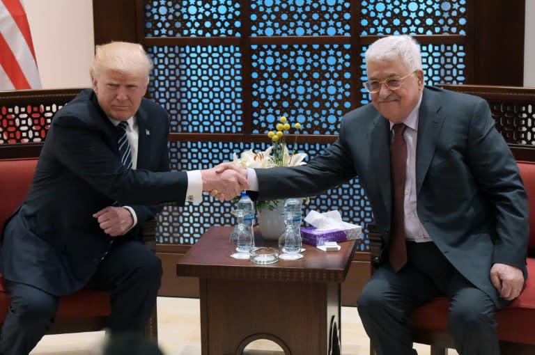 US President Donald Trump (L) shakes hands with Palestinian leader Mahmud Abbas during a meeting in the West Bank city of Bethlehem on May 23, 2017