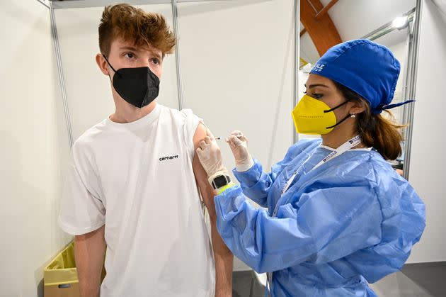 TURIN, ITALY - JUNE 05: A boy receives a first dose of the Pfizer Covid-19 vaccine in the Real Mutua Vaccination Hub on June 05, 2021 in Turin, Italy. The night-time vaccine hub has been reserved for 1000 young people between 18 and 28 years old from 9.30 pm to 3.30 am. The Italian vaccination campaign against COVID-19 involves over 41 percent of the population with more than 600,000 people having been vaccinated today. (Photo by Diego Puletto/Getty Images) (Photo: Diego Puletto via Getty Images)