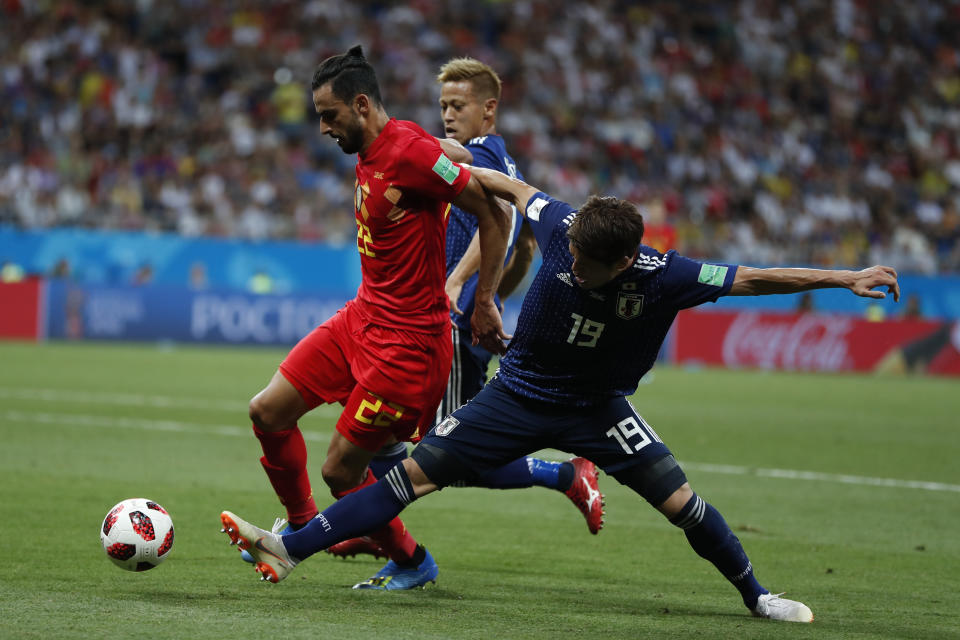 Belgium’s Nacer Chadli, left, vies for the ball with Japan’s Hiroki Sakai during the round of 16 match between Belgium and Japan at the 2018 soccer World Cup in the Rostov Arena, in Rostov-on-Don, Russia, Monday, July 2, 2018. (AP Photo/Natacha Pisarenko)
