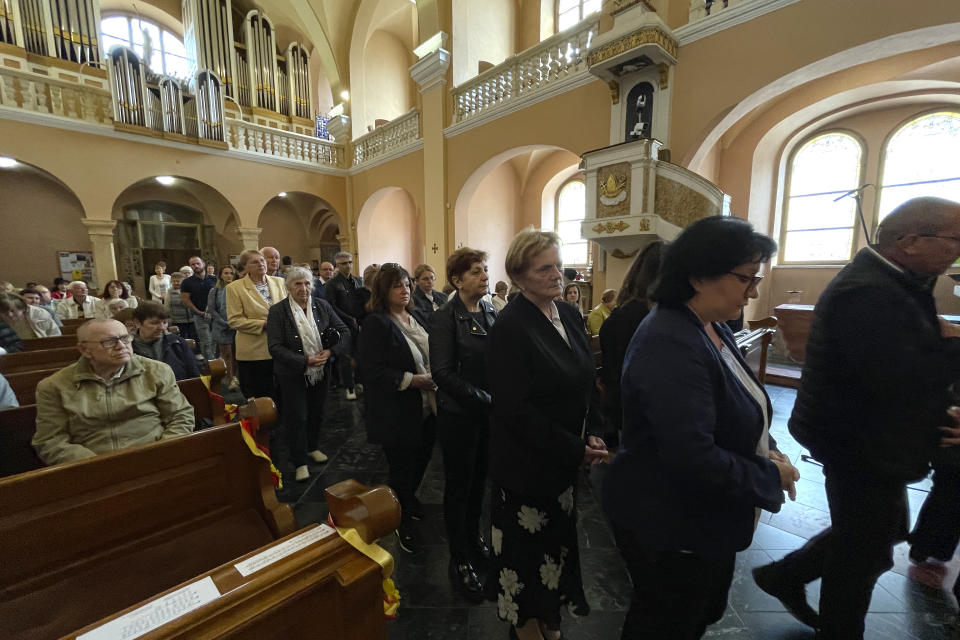 Churchgoers attend a mass at St Francis Xavier Cathedral, in Banska Bystrica, central Slovakia, Sunday, May 19, 2024. Slovakia's populist prime minister, Robert Fico, remained in serious condition on Sunday but has been given a positive prognosis four days after he was shot multiple times in an assassination attempt that has sent shockwaves across the deeply polarized European Union nation, the defense minister Rober Kalinak said. (AP Photo/Lefteris Pitarakis)
