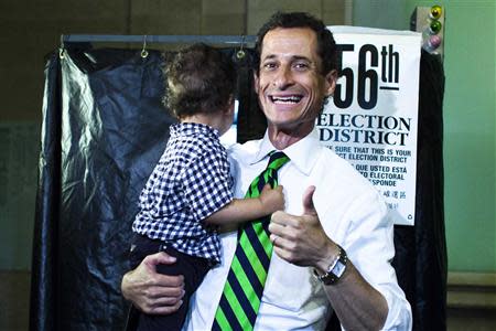 New York City Democratic mayoral candidate Anthony Weiner exits the voting booth with his son, Jordan Weiner, after voting at his polling center in the primary election in New York September 10, 2013. REUTERS/Eduardo Munoz